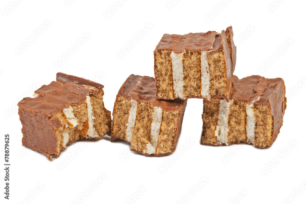 The broken pieces of chocolate biscuit isolated on white The broken pieces of chocolate biscuit isolated on white