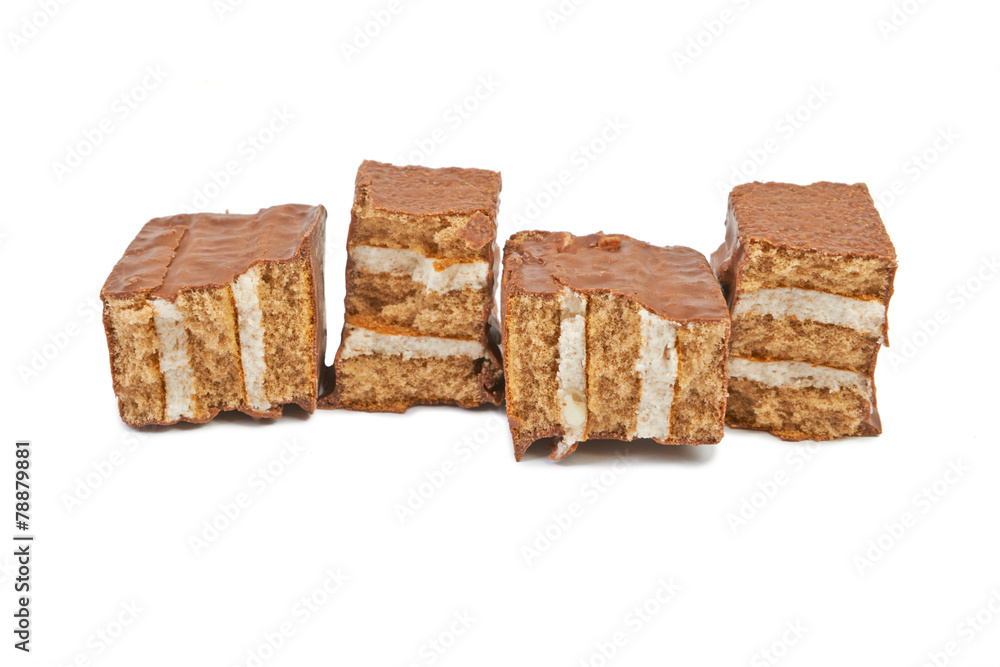 The broken pieces of chocolate biscuit isolated on white The broken pieces of chocolate biscuit isolated on white