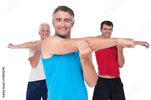 Fit men stretching their arms