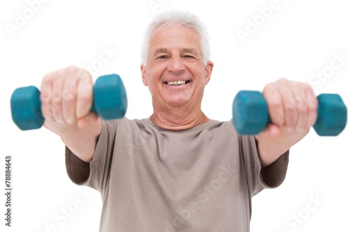 Senior man lifting hand weights