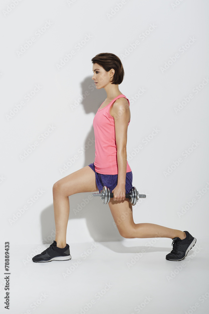 Agile woman with weights Agile woman with weights