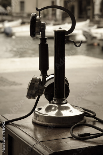 Old telephone sepia photo