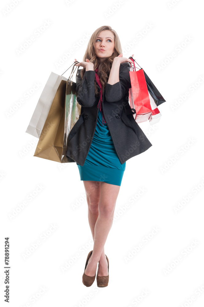 Beautiful and young shopping lady thinking