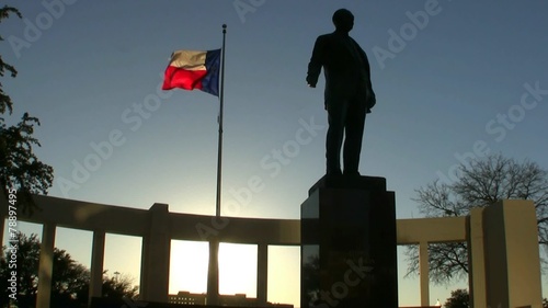 Texas Flag And Statue At Sunset photo