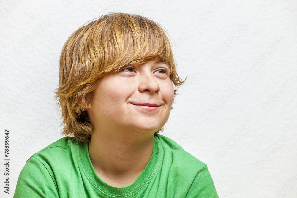 smiling boy sitting on a sofa smiling boy sitting on a sofa