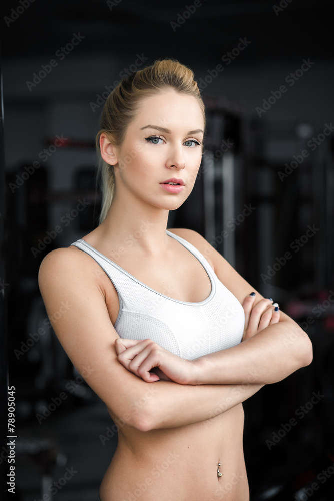Beautiful athletic girl poses in the gym Beautiful athletic girl poses in the gym