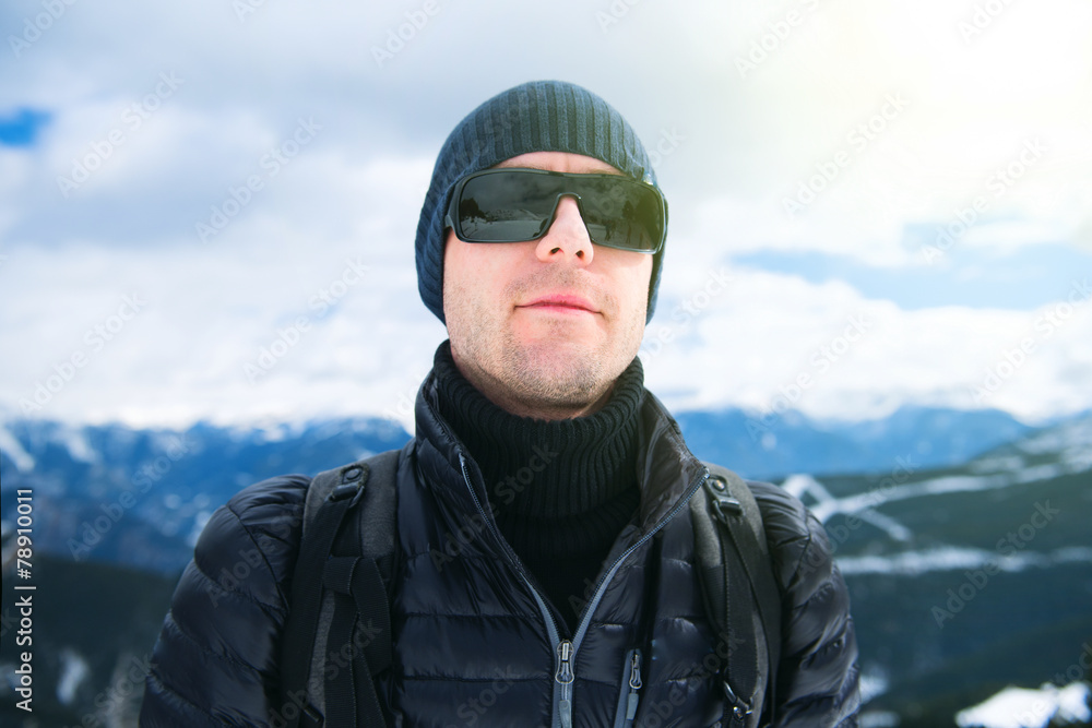 Young man against panorama of mountains, Pyrenees Young man against panorama of mountains, Pyrenees