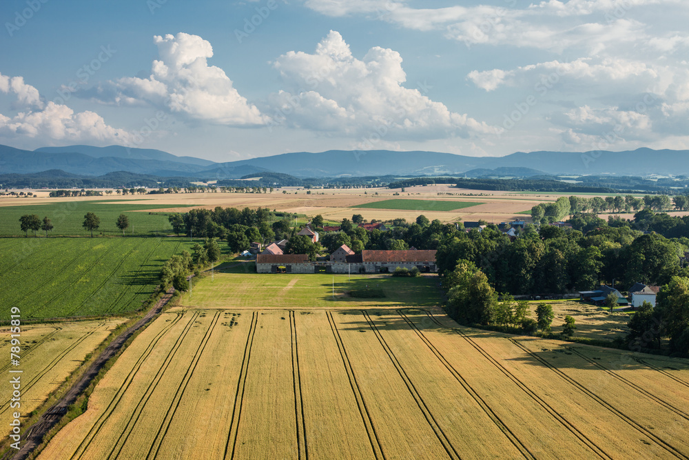 aerial view of   village  harvest fields