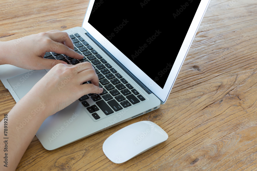 Closeup of business woman hand typing on laptop keyboard Closeup of business woman hand typing on laptop keyboard