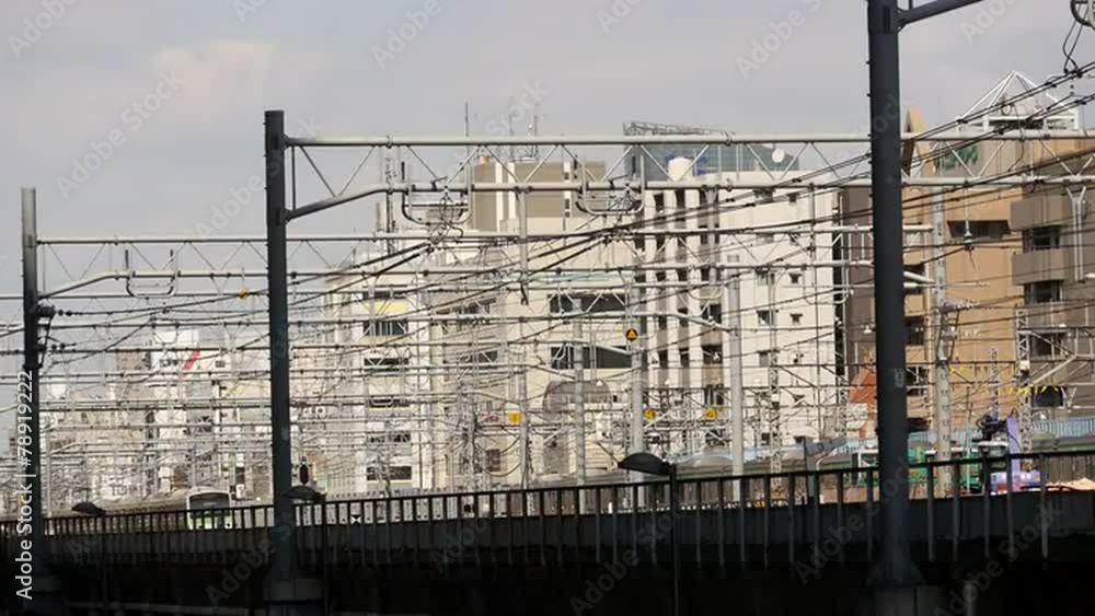 Train Passes over Bridge in Central Tokyo Japan Daytime Train Passes over Bridge in Central Tokyo Japan Daytime
