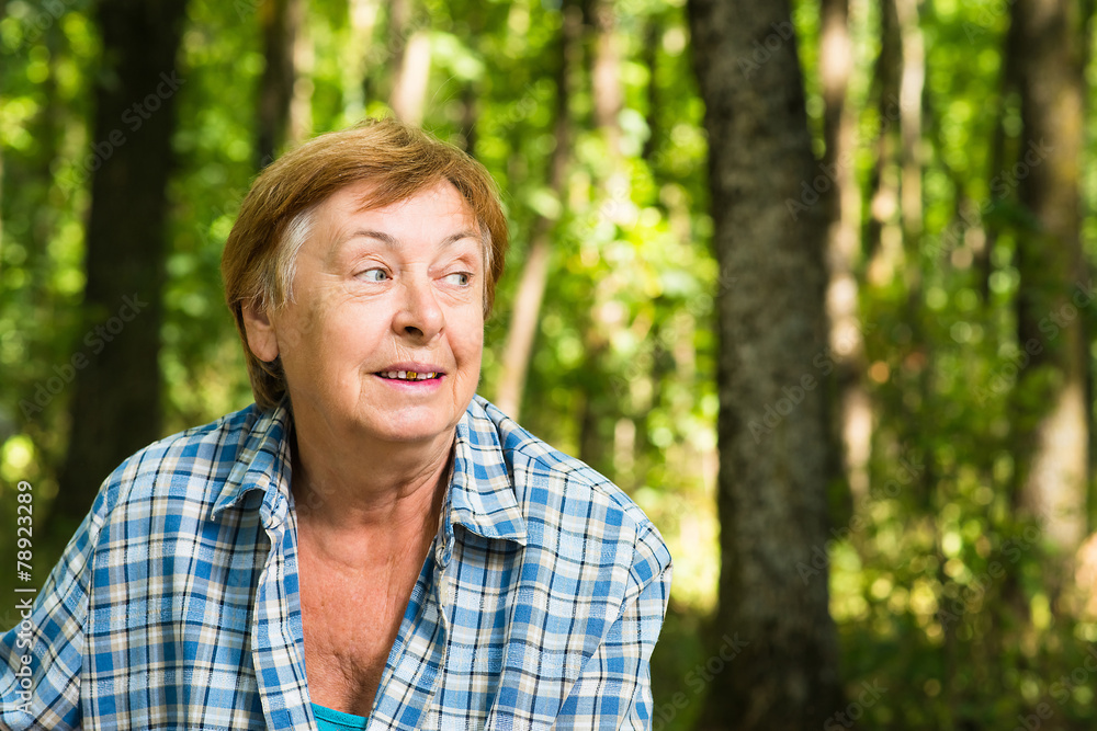 Surprised old woman in the forest Surprised old woman in the forest