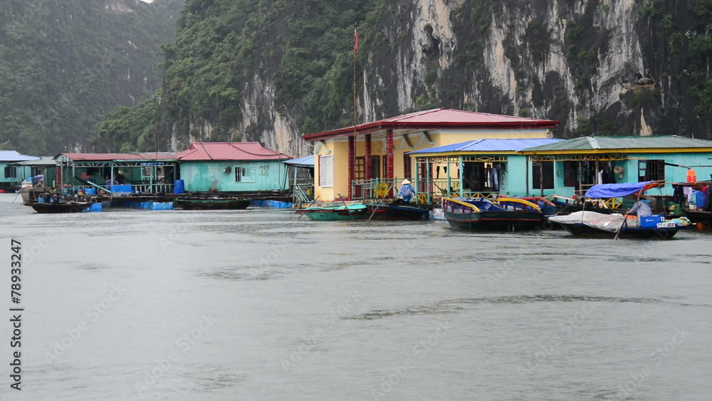 Floating Fishing Village from Boats POV - Ha Long Bay Vietnam Floating Fishing Village from Boats POV - Ha Long Bay Vietnam