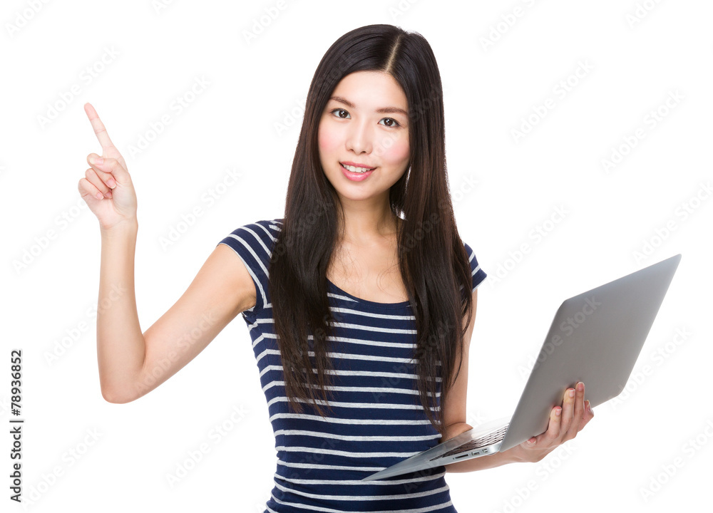 Asian woman hold with laptop and finger point up Asian woman hold with laptop and finger point up