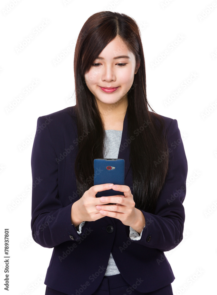 Businesswoman use of cellphone Businesswoman use of cellphone