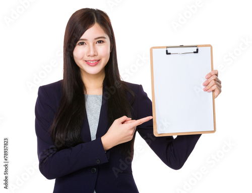 Asian businesswoman finger point to clipboard