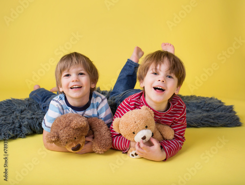 Happy Kids, Siblings, Hugging stuffed toys