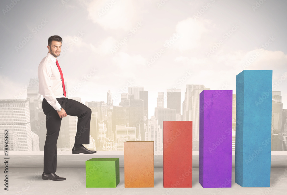 Business person climbing up on colourful chart pillars concept