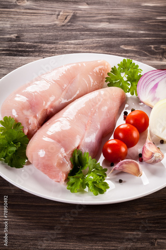 Raw chicken fillets photo