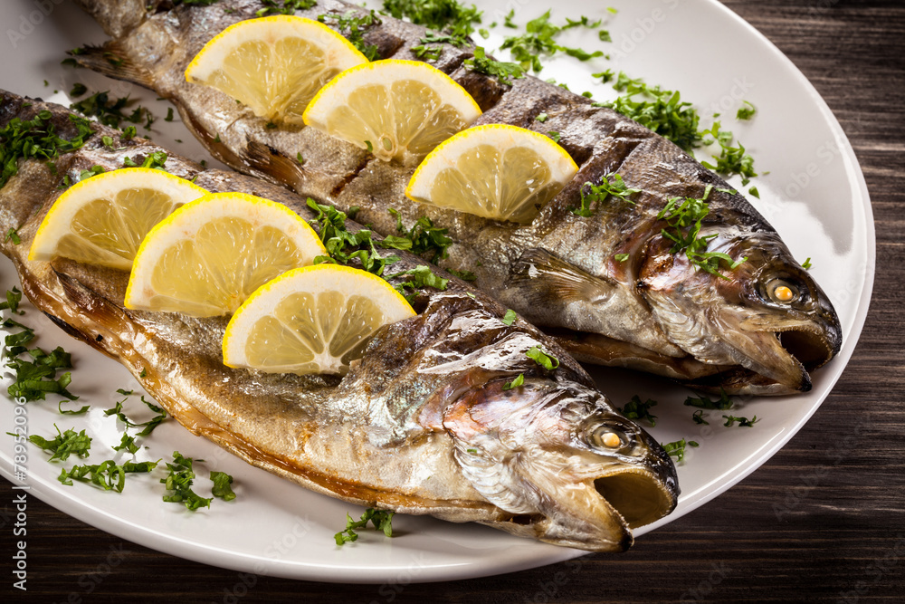 Fish dish - fried fish fillet with vegetables Fish dish - fried fish fillet with vegetables