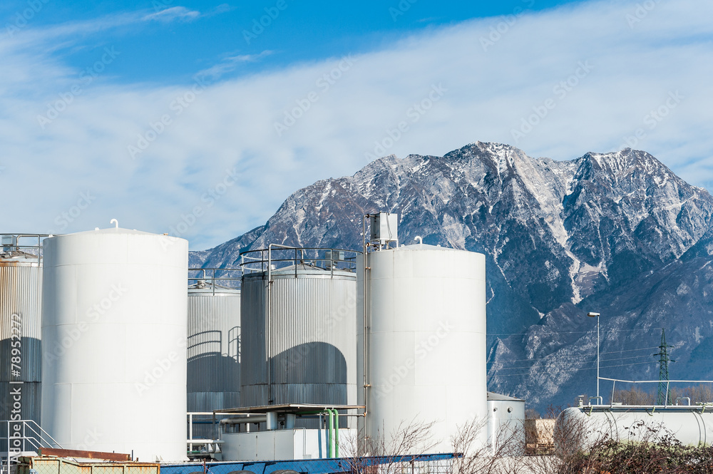 Obraz premium Industrial plant with behind the Italian Alps