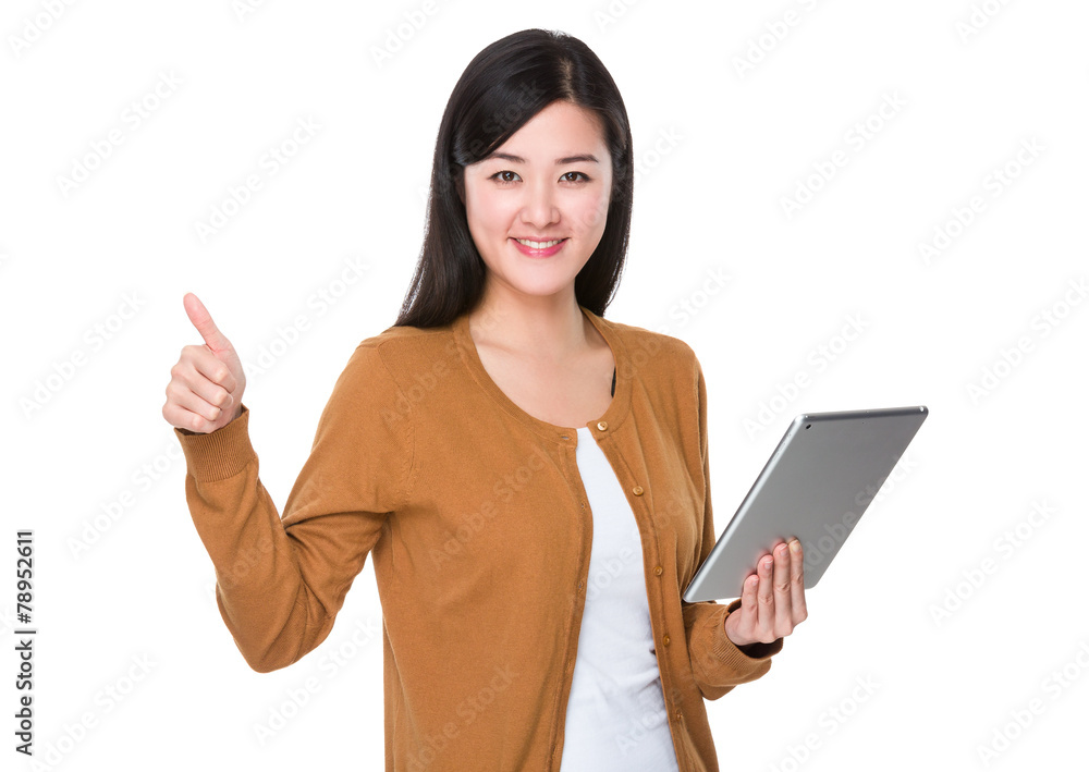Woman use of tablet and thumb up Woman use of tablet and thumb up