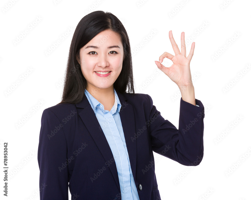 Businesswoman with ok sign gesture Businesswoman with ok sign gesture