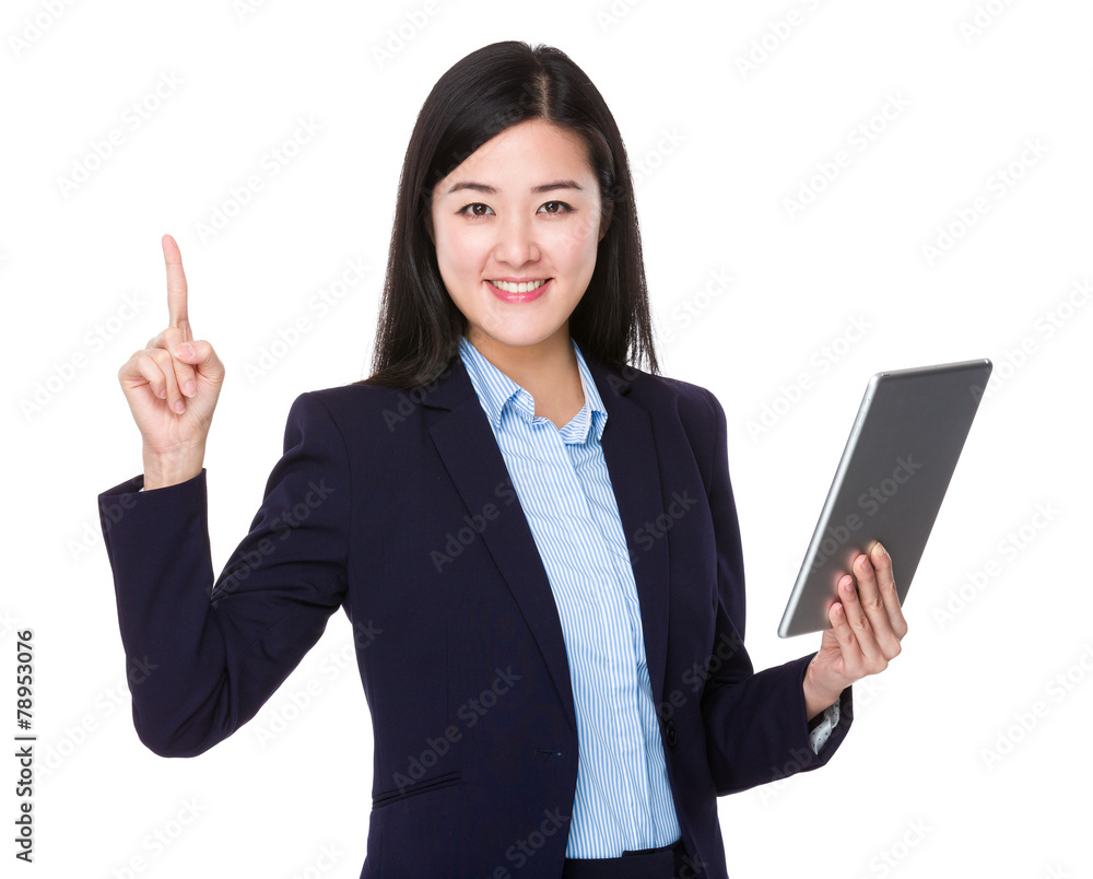 Businesswoman use of tablet and finger point up Businesswoman use of tablet and finger point up