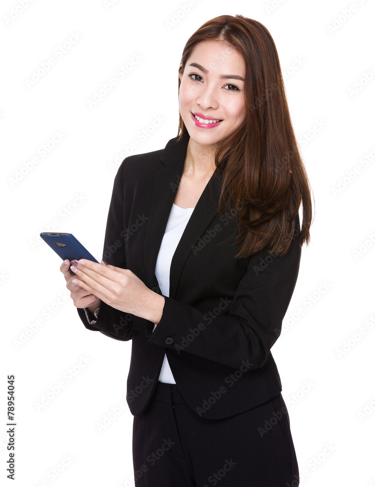 Asian businesswoman hold with the mobile phone Asian businesswoman hold with the mobile phone