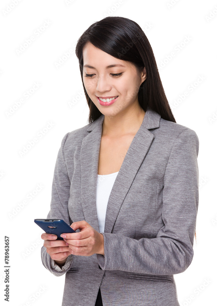 Business woman look at the cellphone Business woman look at the cellphone
