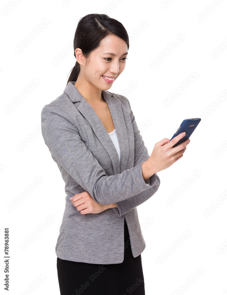 Businesswoman use of cellphone Businesswoman use of cellphone