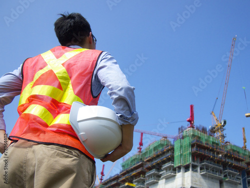 Construction worker holding a helmet