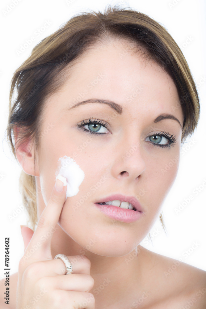 Attractive Young Woman Applying Moisturizing Cream Attractive Young Woman Applying Moisturizing Cream