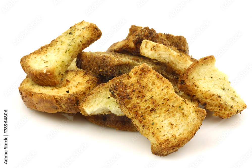 Italian baked toast with garlic and herbs on a white background