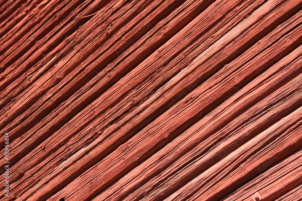 Old red wooden wall in sunlight Old red wooden wall in sunlight