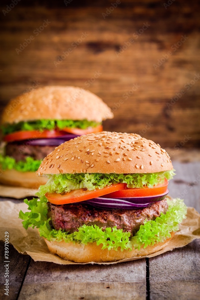 two homemade hamburgers with organic vegetables two homemade hamburgers with organic vegetables