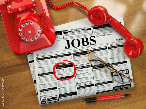 Looking for a job. Jobs vacancies. Newspaper with advertisments,