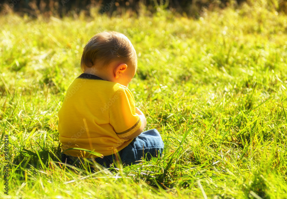 Boy Sitting in Happy Quiet Solitude Outside Boy Sitting in Happy Quiet Solitude Outside