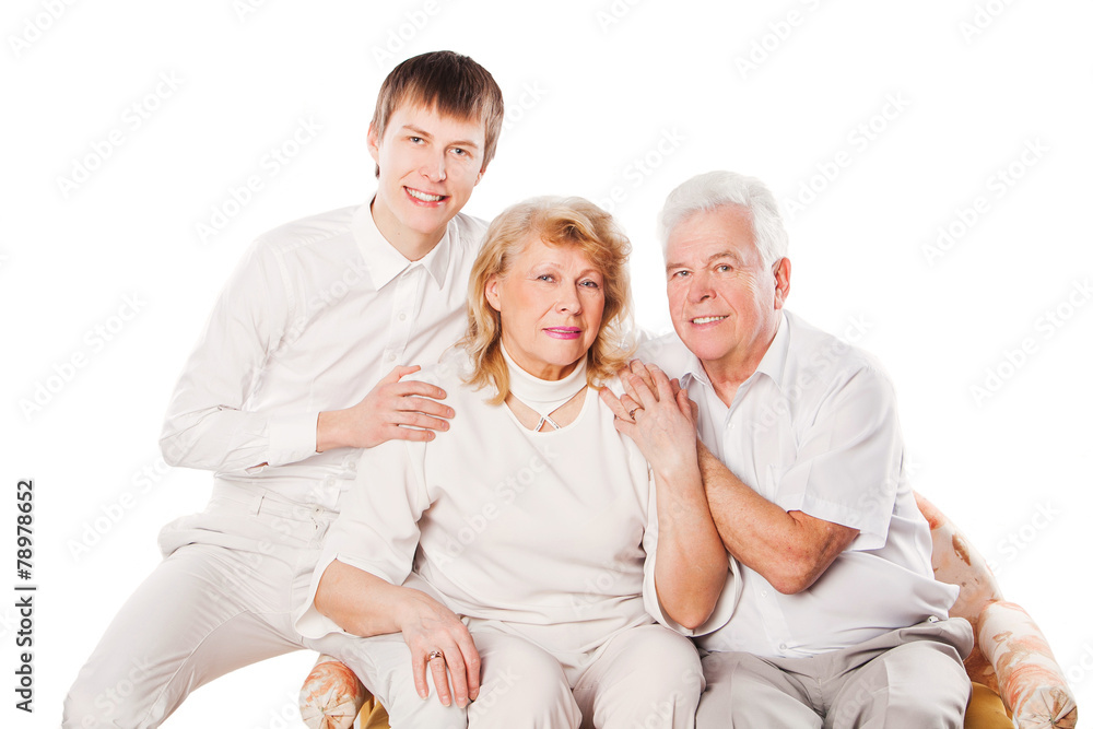 Portrait of happy senior couple and son on white background