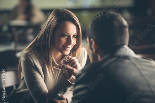 Romantic couple flirting at the bar photo