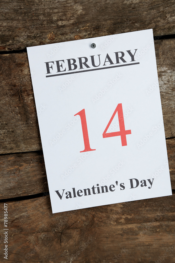 Valentines Day, February 14 on calendar on wooden background