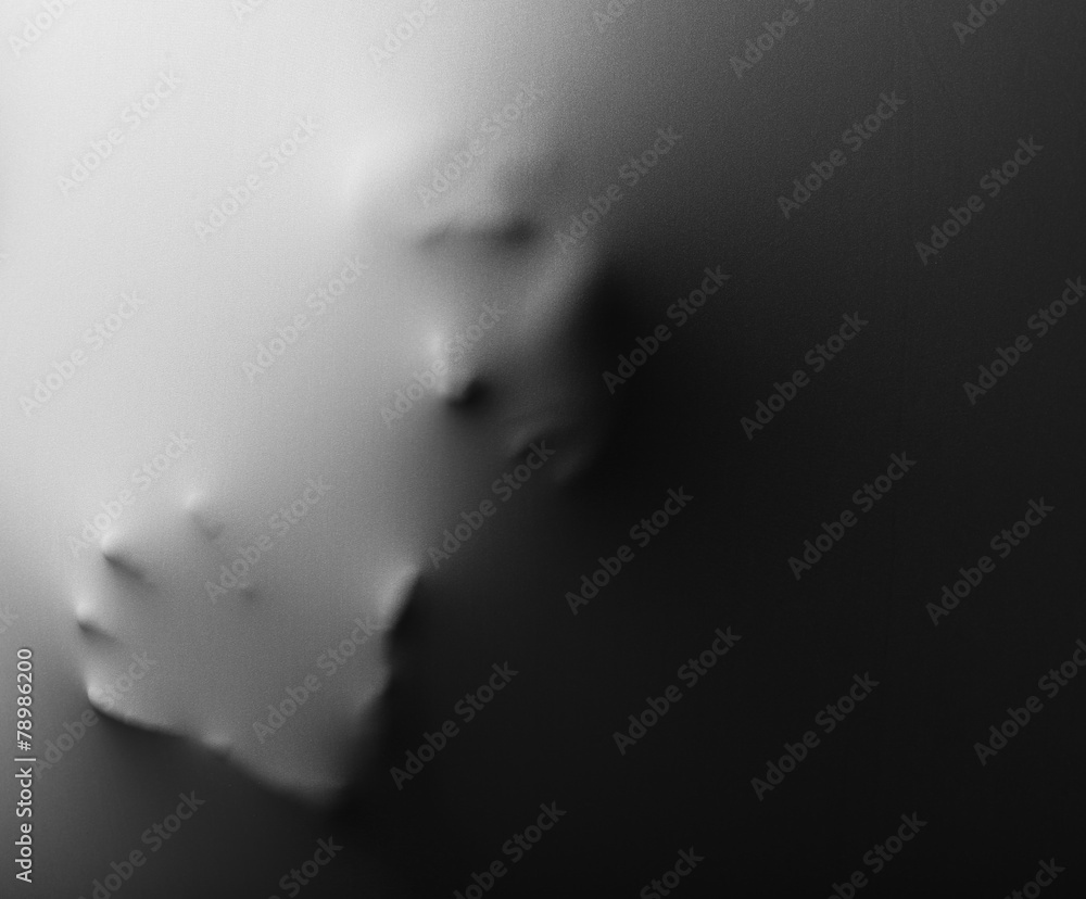 Obraz premium Human face and hand pressing through fabric as horror
