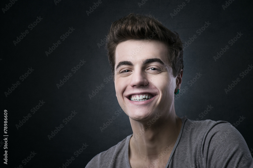 Fototapeta premium Smiling handsome young man posing