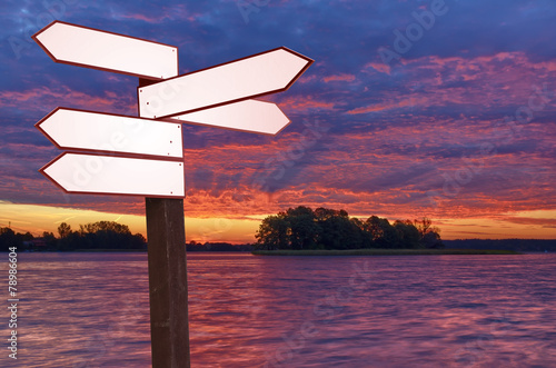Guidepost on a lakeshore