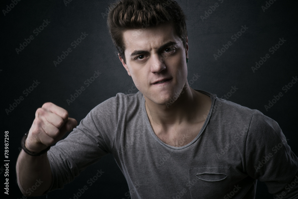 Young man showing fists