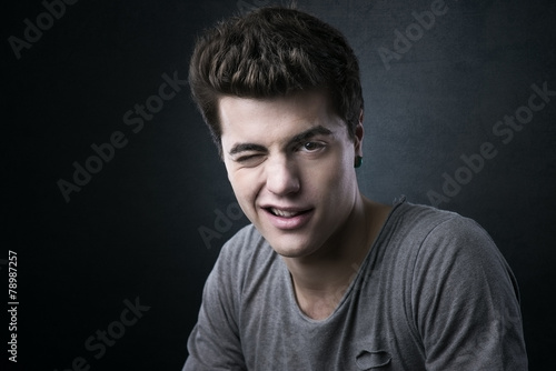 Handsome teenager blinking