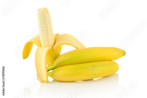 Studio shot of peeled banana with bananas and pieces