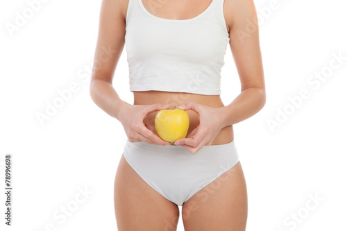 Body woman in underwear with a apple