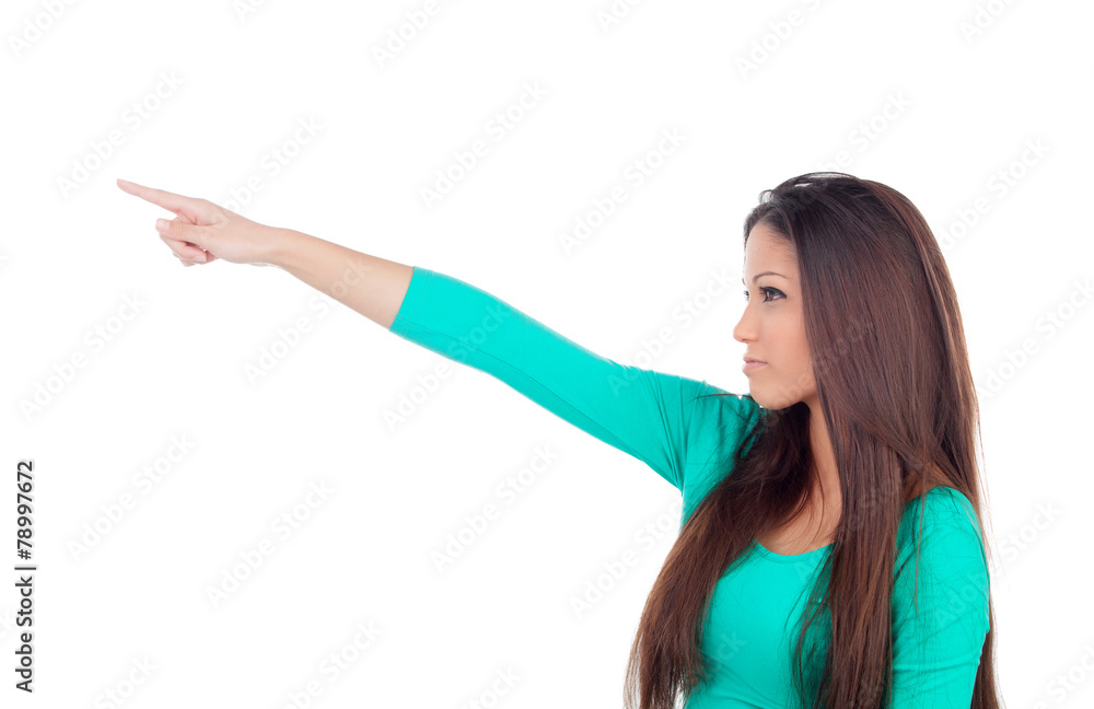 Cute young woman indicating something with the finger