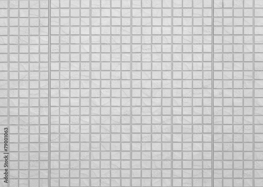 THe modern white concrete tile wall background and texture .