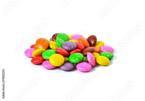 lots of colorful candies spread on white background